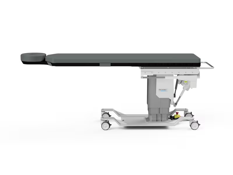 The CFPM401 table from the side: carbon fibre table top with integrated headrest, adjustable column and lockable castor base